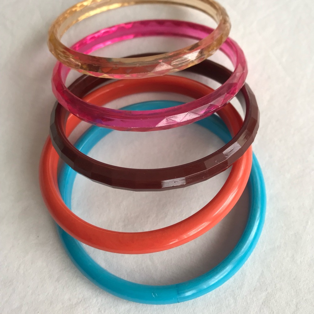 Five vintage 70’s plastic/lucite bangle bracelets